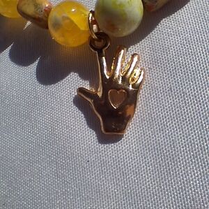 Yellow and Orange Beaded Bracelet with Hand Charm